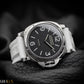 Panerai watch with black dial and white strap on a dark background