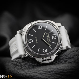 Panerai watch with black dial and white strap on a dark background