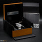 Panerai watch in an open box with accessories on a dark background