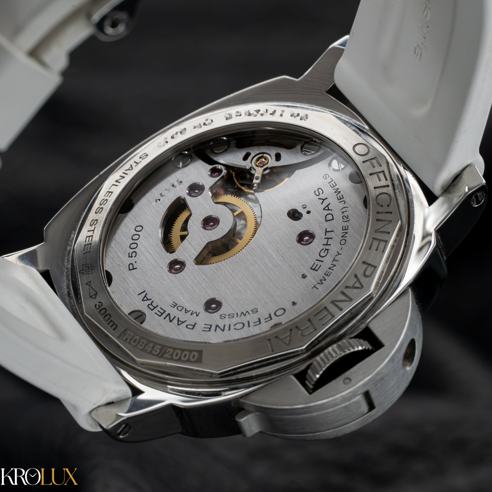 Close-up of a Panerai watch with visible brand name on a dark background