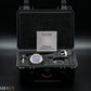 Box shot. Watch in a black case with an instruction manual on a dark background, featuring the Krolux brand.