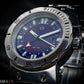 Close up. Wristwatch with a blue dial and silver case on a dark background
