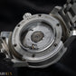 Case back. UTS Munchen Close-up of a watch's mechanical movement with 'Krolux' branding.